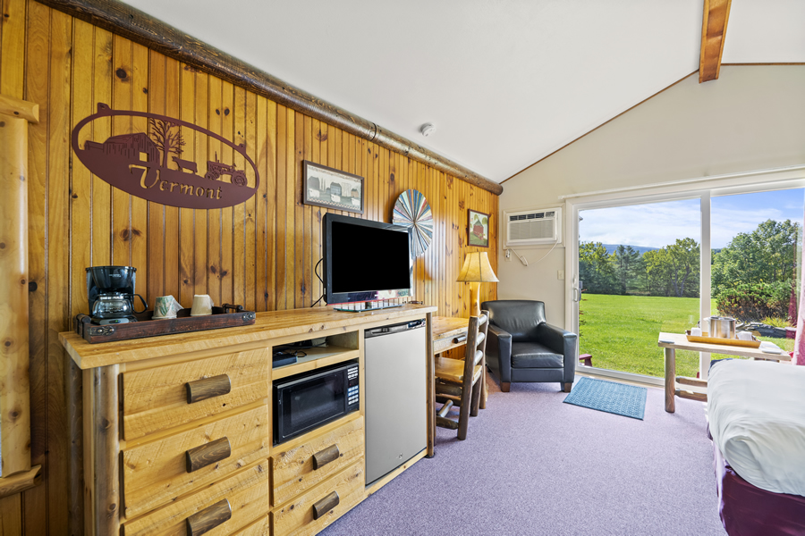 north shire lodge cottages interior with micro and desk, tv and fridge,