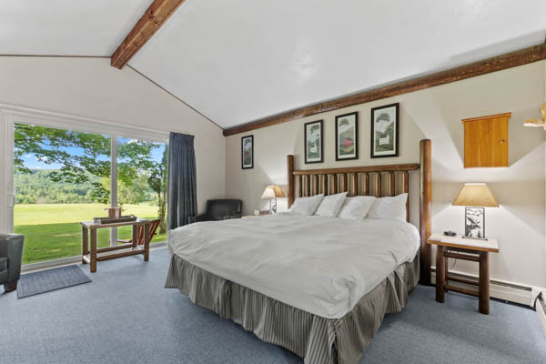 room 15 features a deluxe king bed with duvet comforter and beautiful patio views