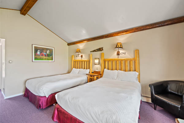 features two extra long double beds (same length as a king bed) with duvet comforters.