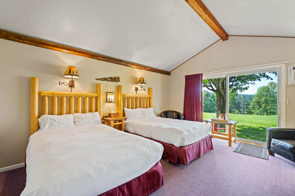 features two extra long double beds (same length as a king bed) with duvet comforters.