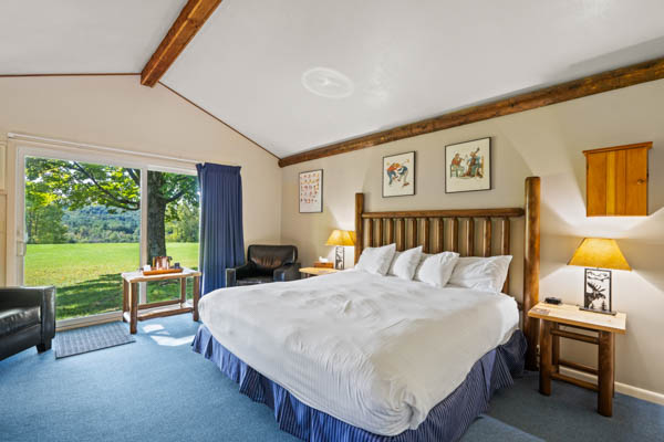 room 14 features a deluxe king bed with duvet comforter and beautiful patio views