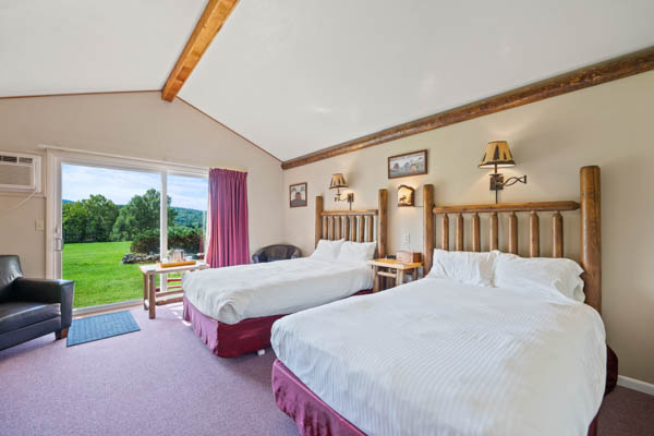 room 9 features two extra long double beds (same length as a king bed) with duvet comforters.