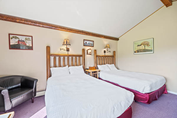 room 9 features two extra long double beds (same length as a king bed) with duvet comforters.
