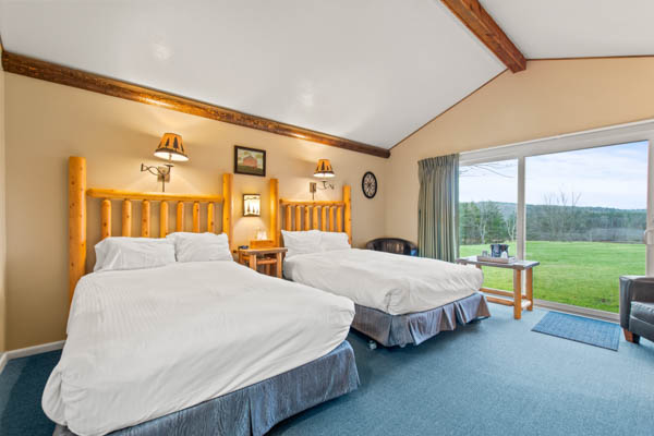 features two extra long double beds (same length as a king bed) with duvet comforters.