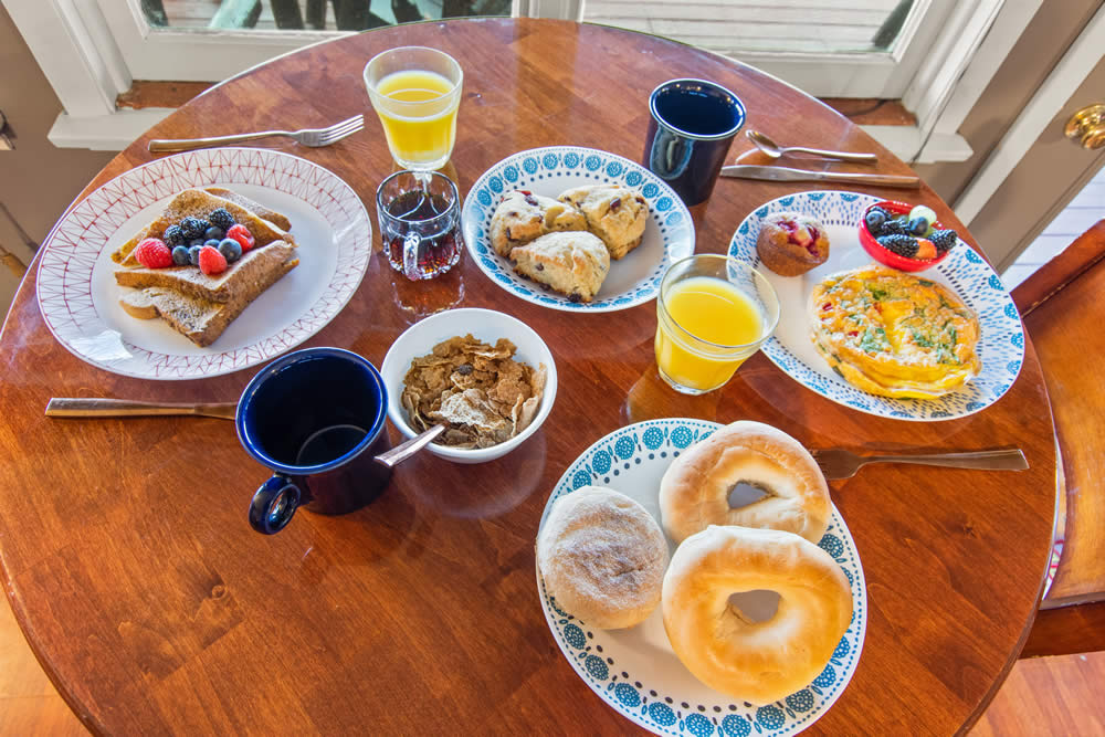 breakfast with bagels, egges, french toast and scones
